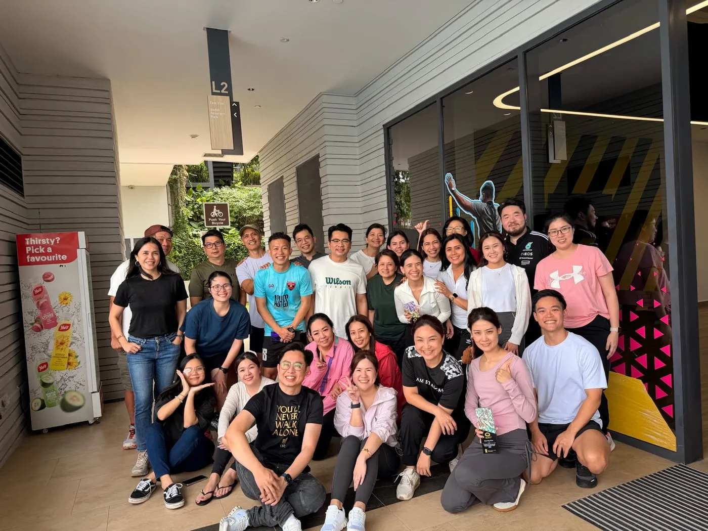 A group photo of Shermene’s team after an outdoor event